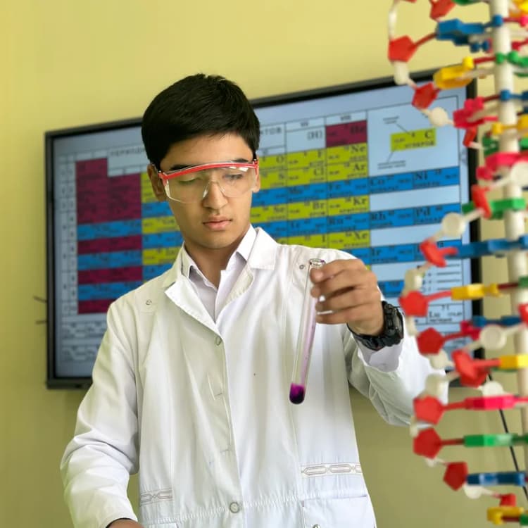 Student in a chemistry lab at Asia Kids School